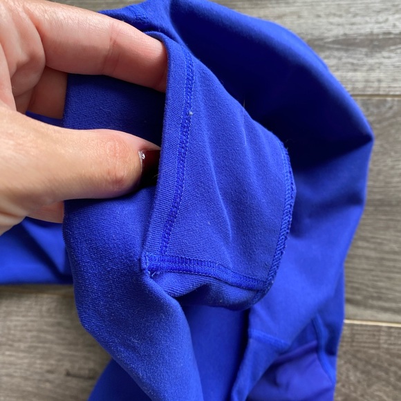 Fabletics Powerhold Royal Blue Cropped Leggings w/ mesh side cutout and pockets - Picture 3 of 8